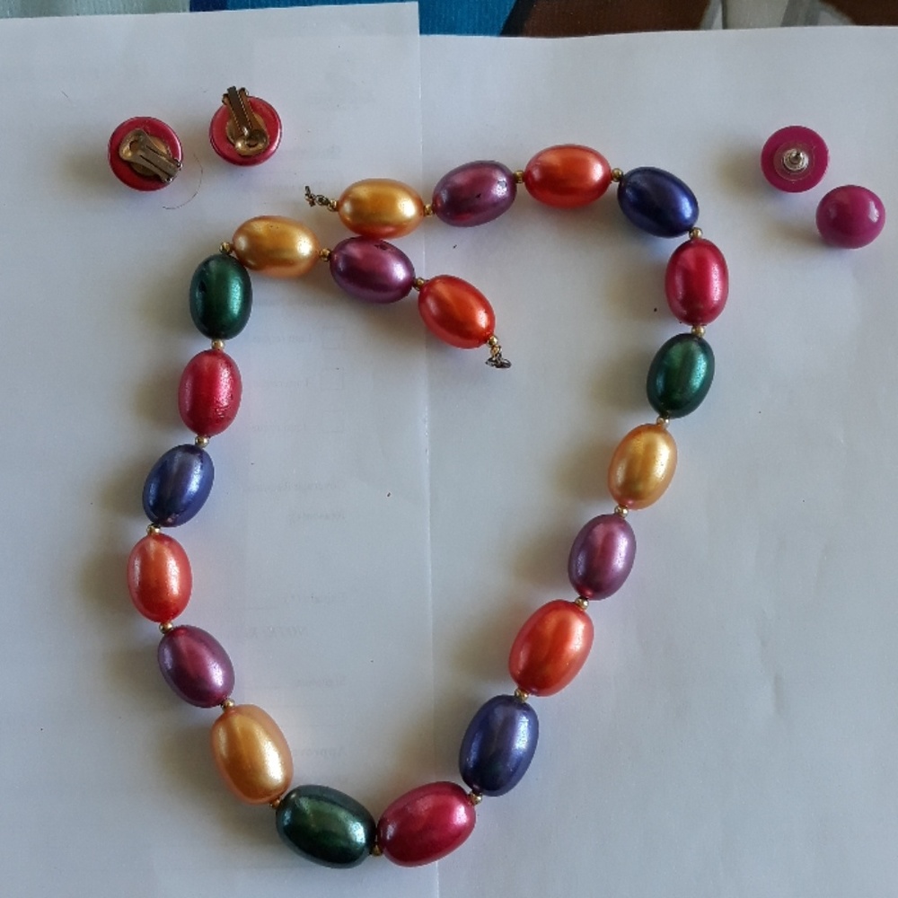 Necklace with 2 pair of matching earrings.